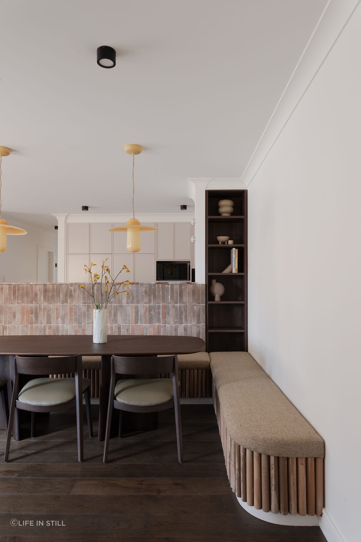 Stand-out features include honey-coloured Italian glass pendants, designed by Sjoerd Vroonand and made in the Netherlands for Space Furniture, that have been hung above the dining table.