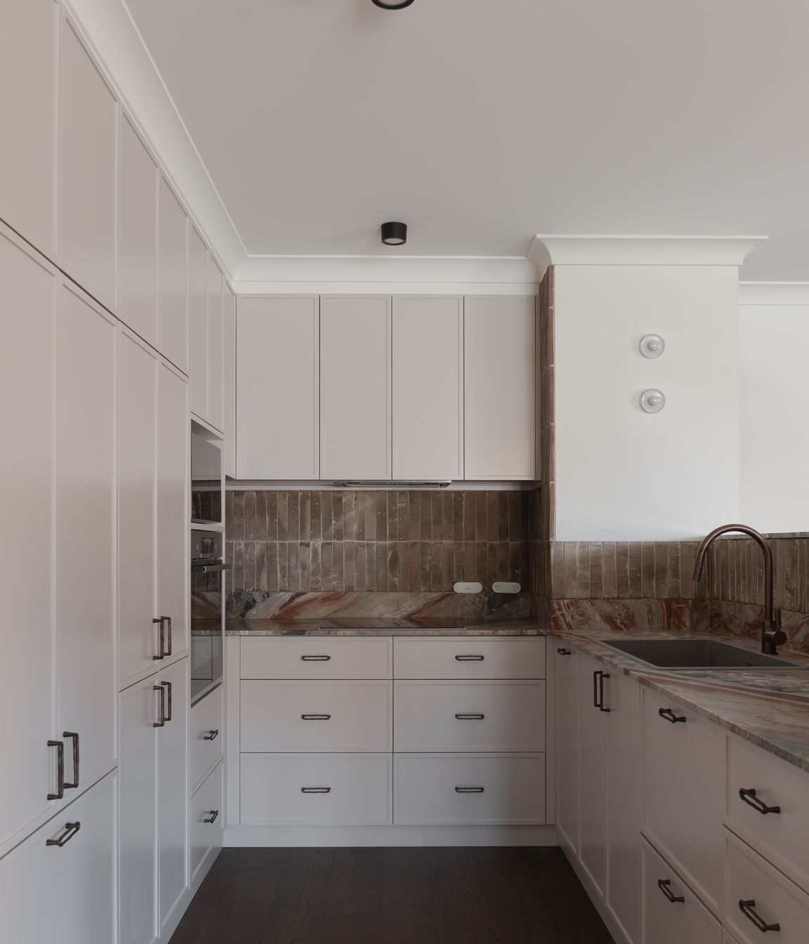 Custom handmade terracotta fluted tiles, created by Earp Brothers, drove the design for this apartment.