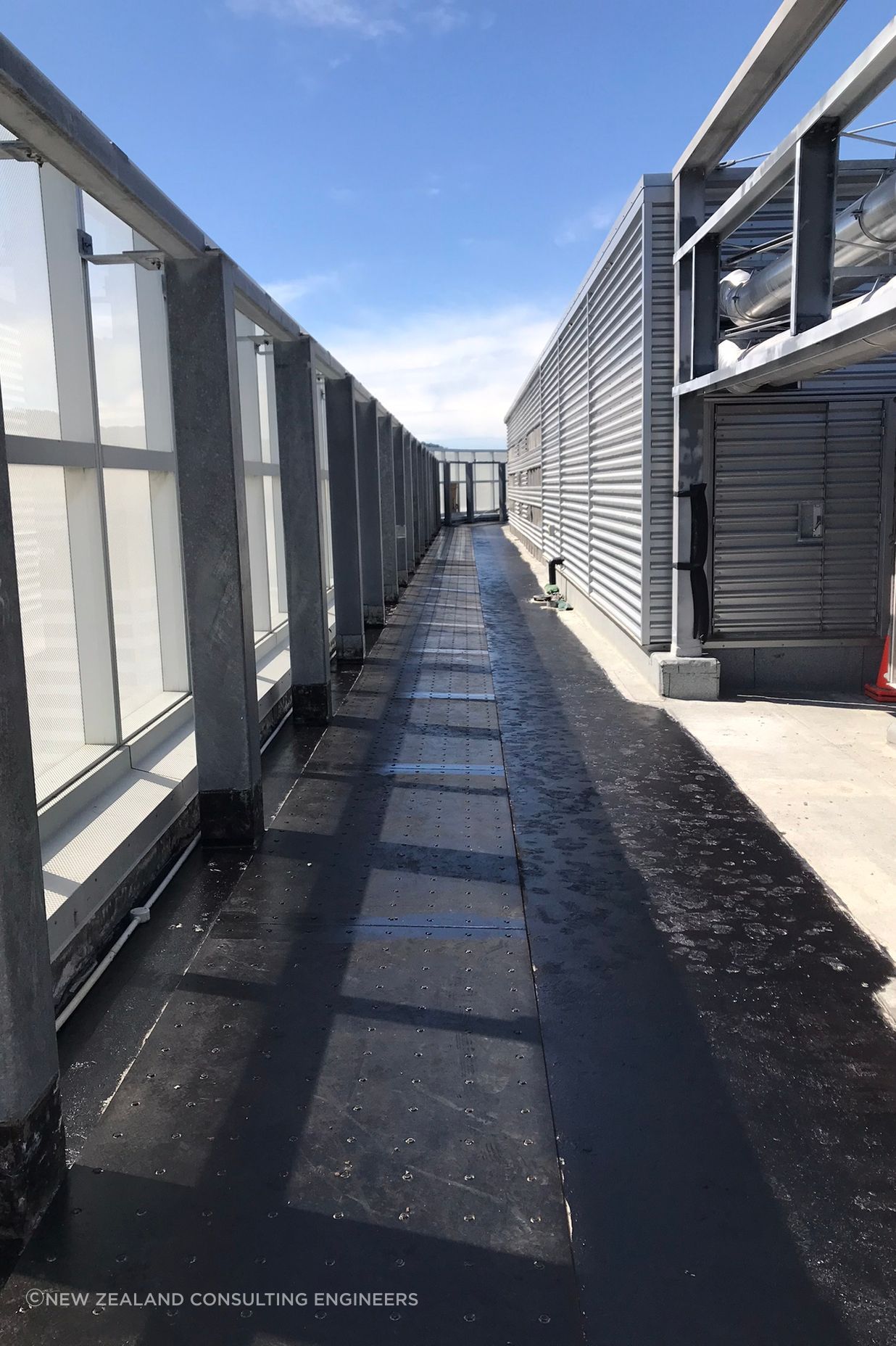 "At the roof level the steel plates had to increase to 12mm and 16mm thickness, with a large 1500mm deep and 850mm wide concrete collar installed around the core of the building to allow for the diaphragm forces to be transferred into the core."