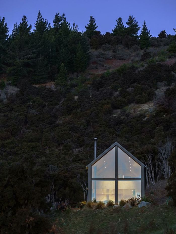 The site is a clearing amongst dense forest.