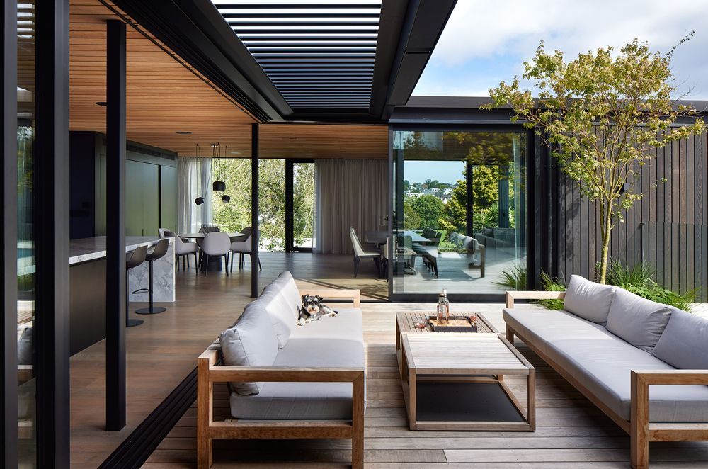 Blurring the lines between indoors and out, the outdoor entertainment area is a direct extension of the interior kitchen, living and dining.