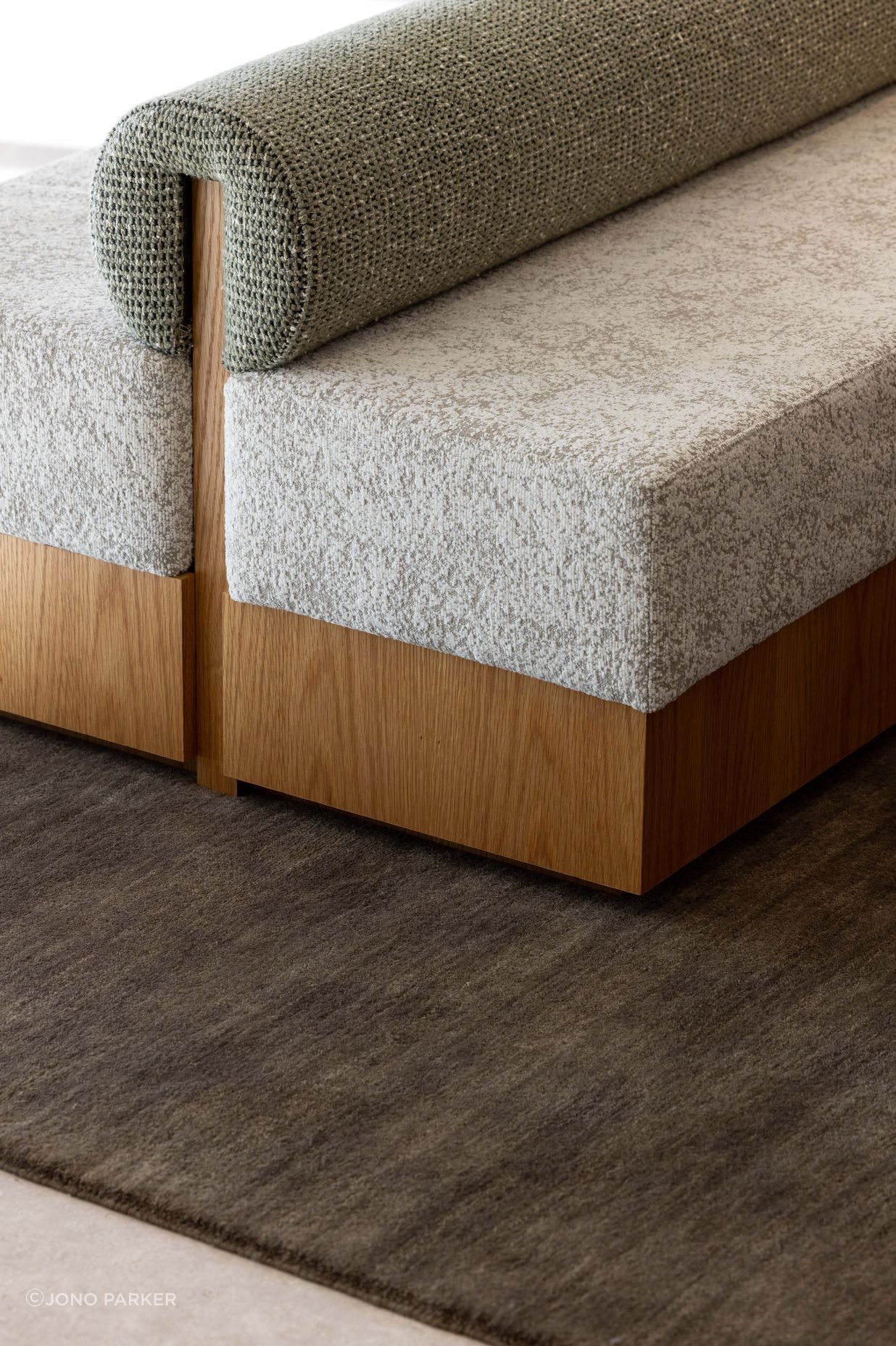 The custom ottoman was made by Evolution Construction & Interiors.