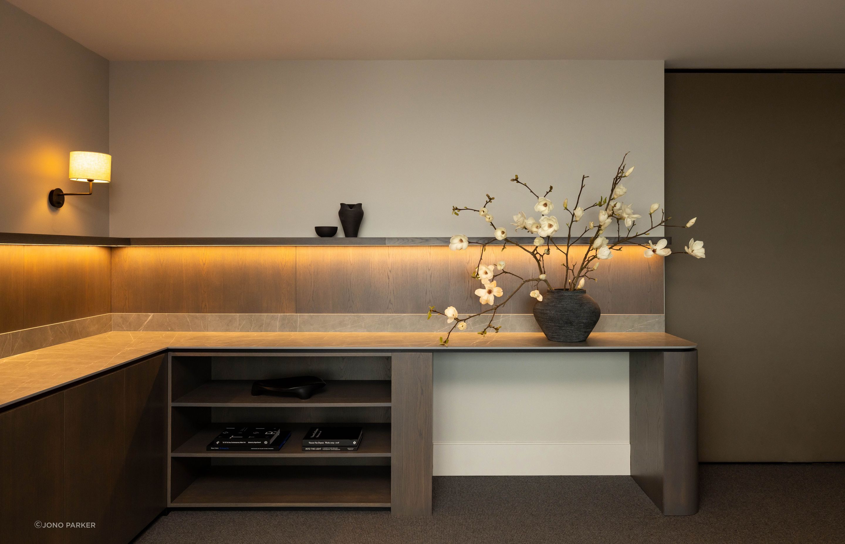 The boardroom joinery is sophisticated and darker in tone compared to the reception and waiting area.