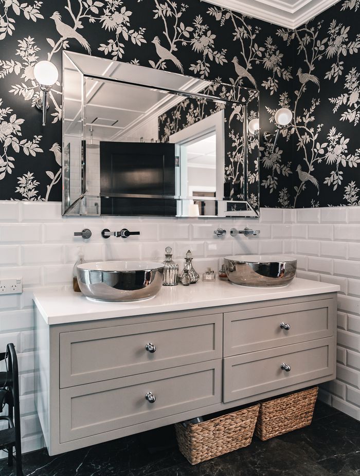 The master ensuite includes a freestanding bathtub from Franklins and separate shower; cabinets from Blanc Industries; and a classic black and white colour palette.
