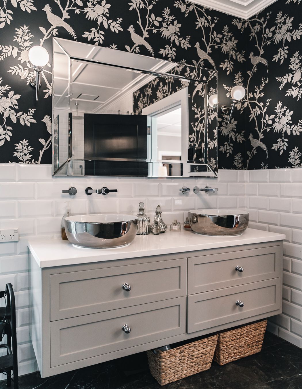 The master ensuite includes a freestanding bathtub from Franklins and separate shower; cabinets from Blanc Industries; and a classic black and white colour palette.