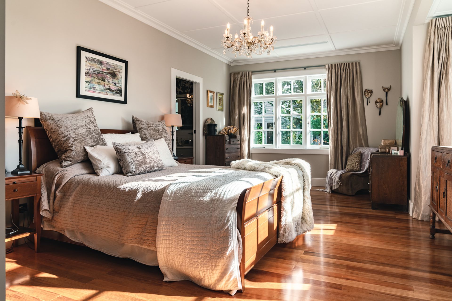 Upstairs, the master bedroom has a panelled ceiling – a nod to the home’s heritage.
