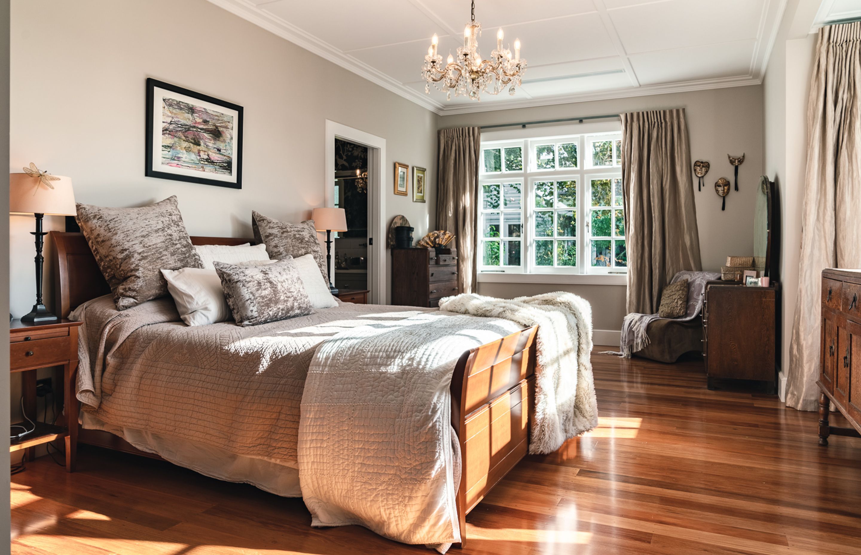 Upstairs, the master bedroom has a panelled ceiling – a nod to the home’s heritage.