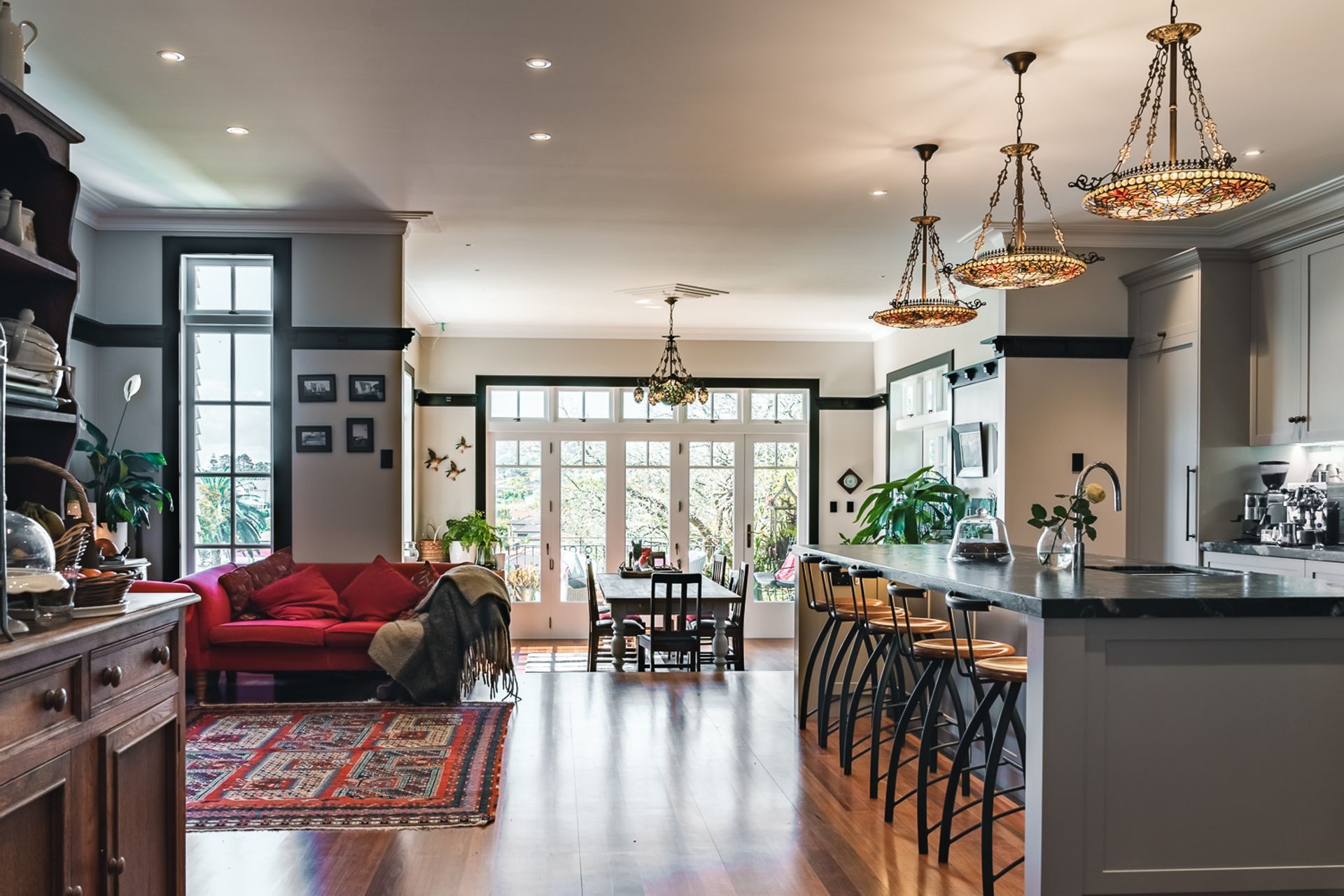 “At the front stepped down from the kitchen is the dining room, which is fully glazed to let in heaps of natural light. There’s a sitting area that is used as a coffee spot right next to the kitchen, which ties in nicely,” shares Joseph.