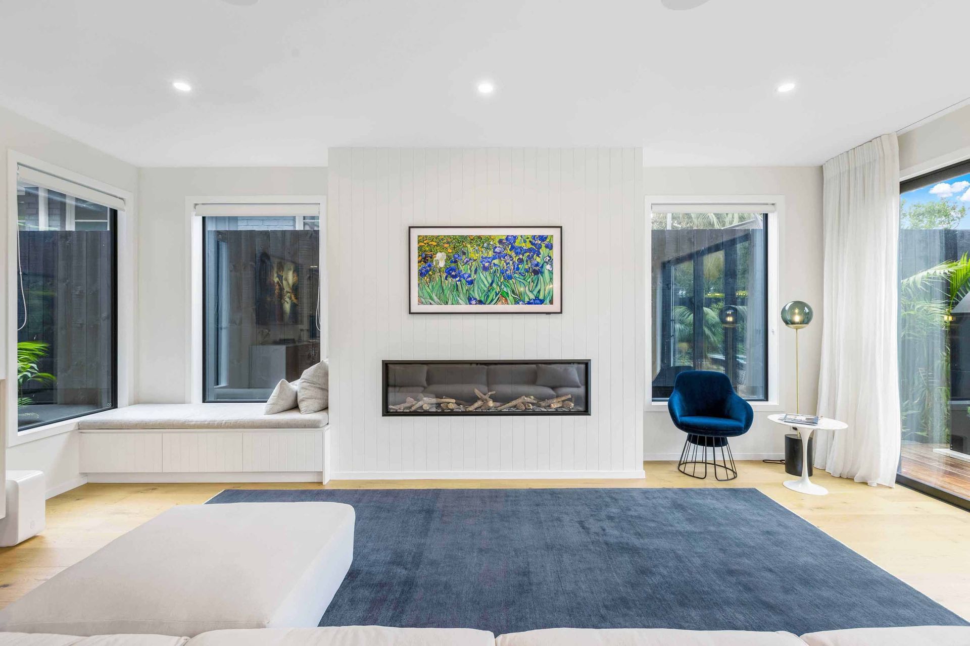 The downstairs living space enjoys light from all sides and has direct access to the outdoor living space through sliders.