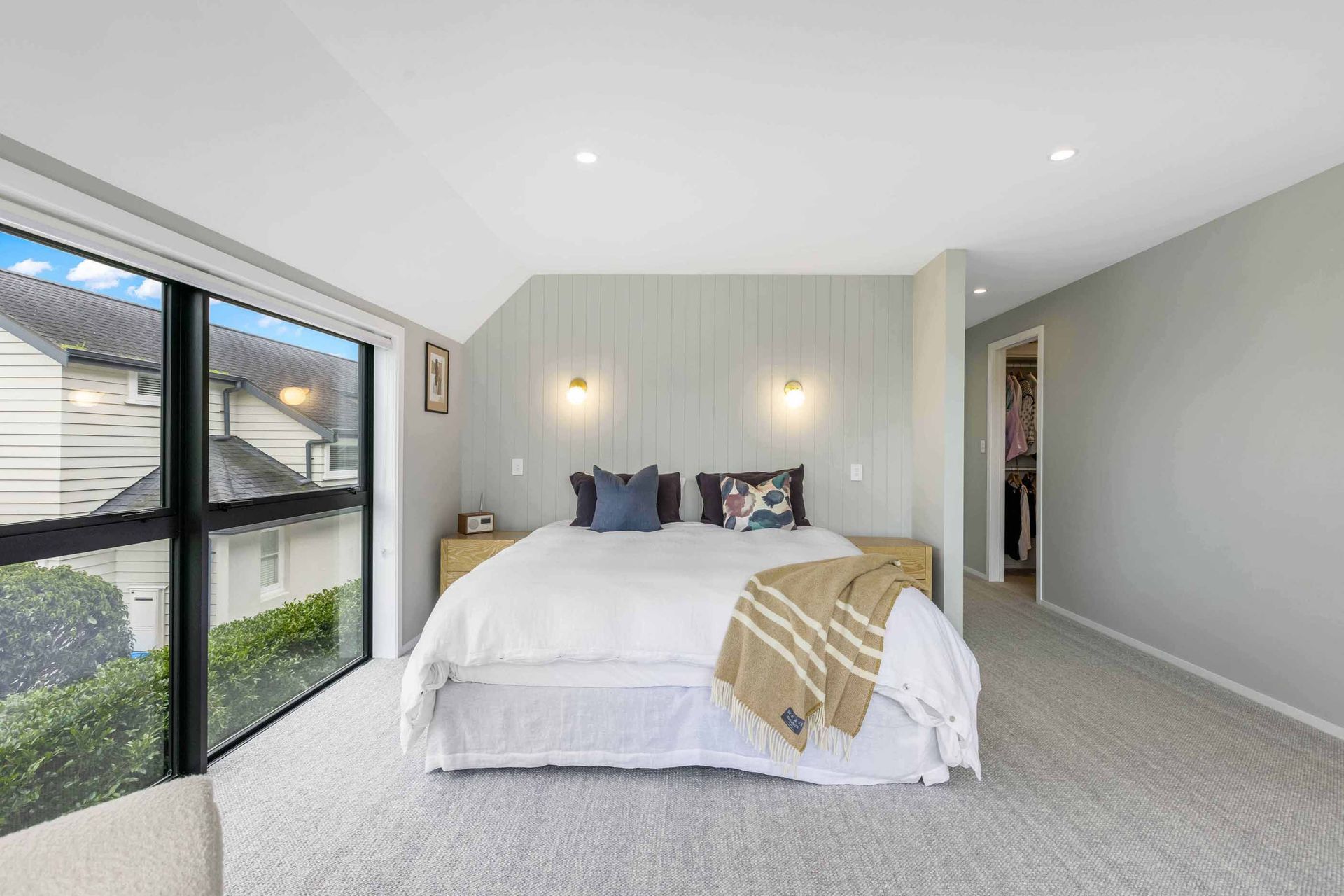 The master suite has its own private spot upstairs, overlooking the pool area.