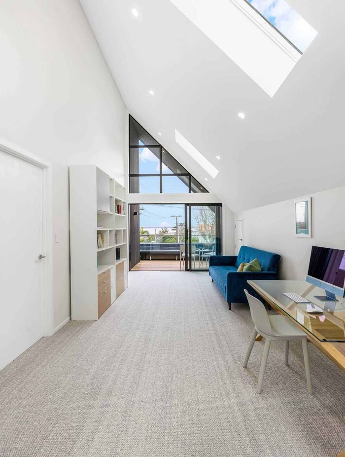 Upon walking upstairs, the impressive full height volume of the upstairs living space is a show-stopping moment.