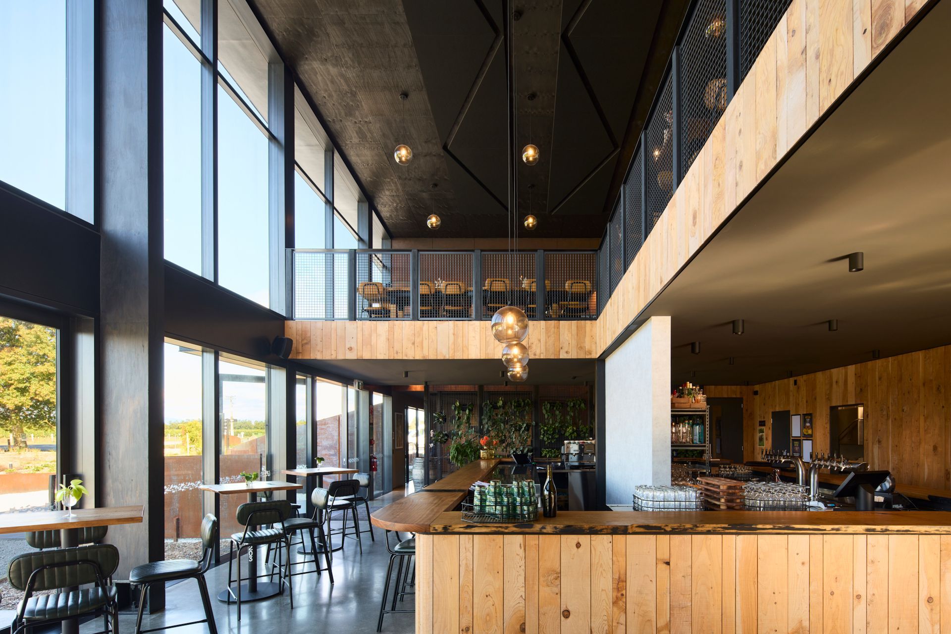 To the north, the main cellar door and dining area are lit by all-day sunlight.