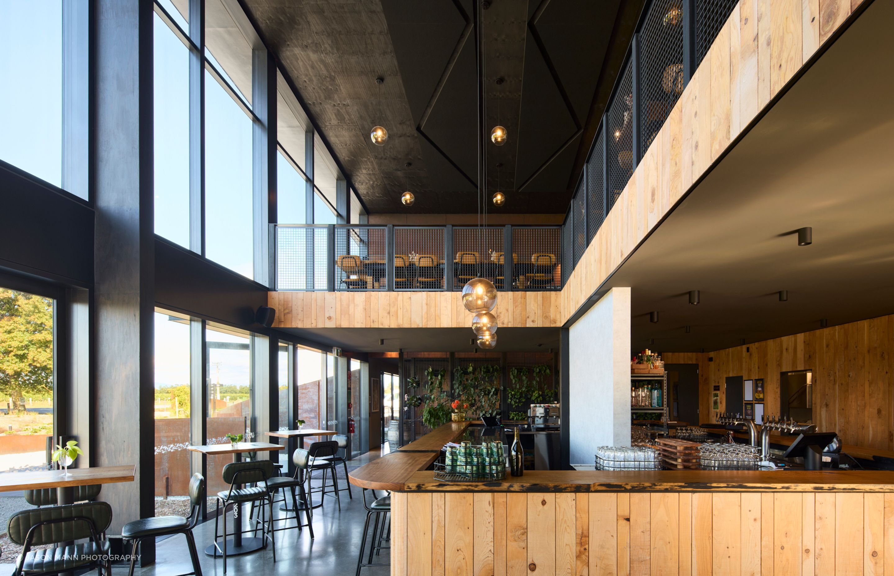 To the north, the main cellar door and dining area are lit by all-day sunlight.