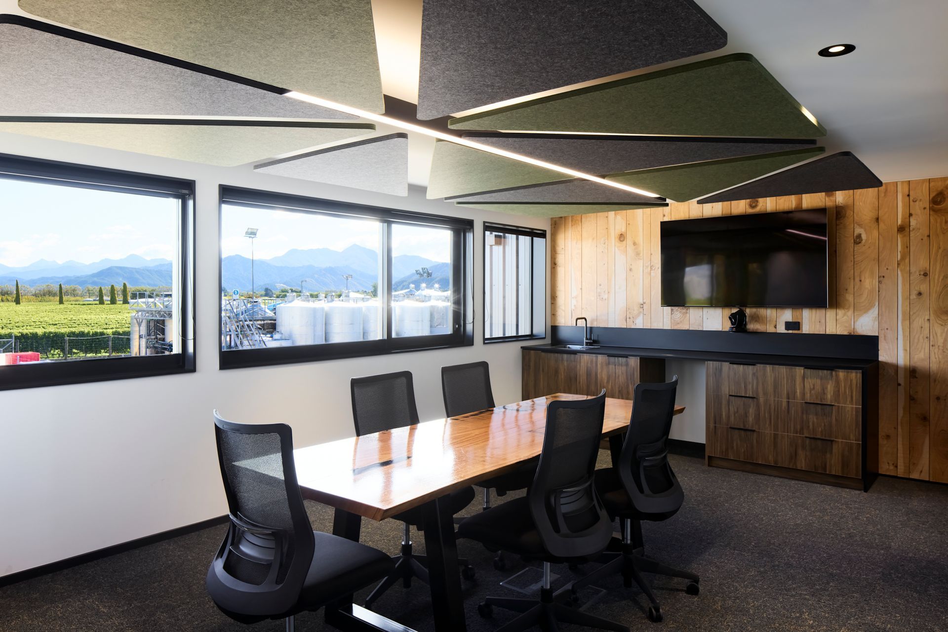 Upstairs, an open-plan office space includes a boardroom.