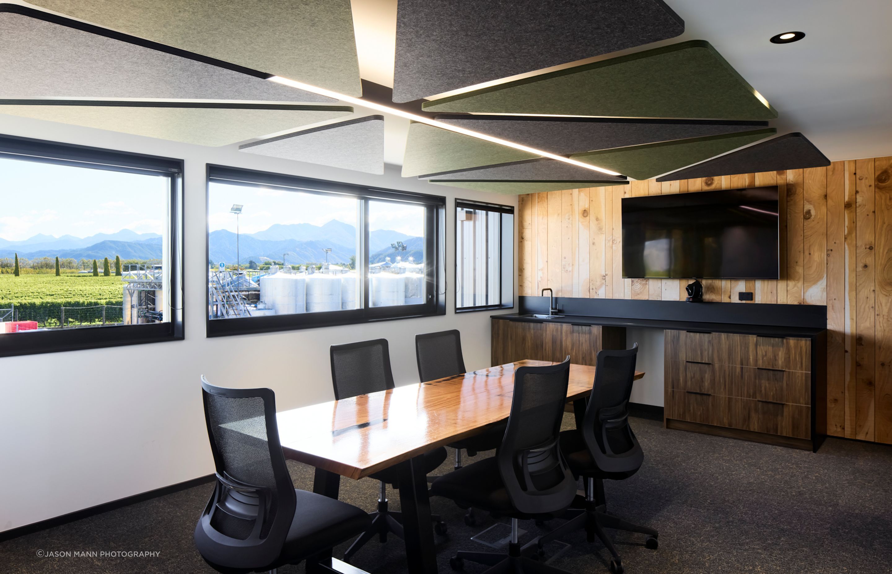 Upstairs, an open-plan office space includes a boardroom.