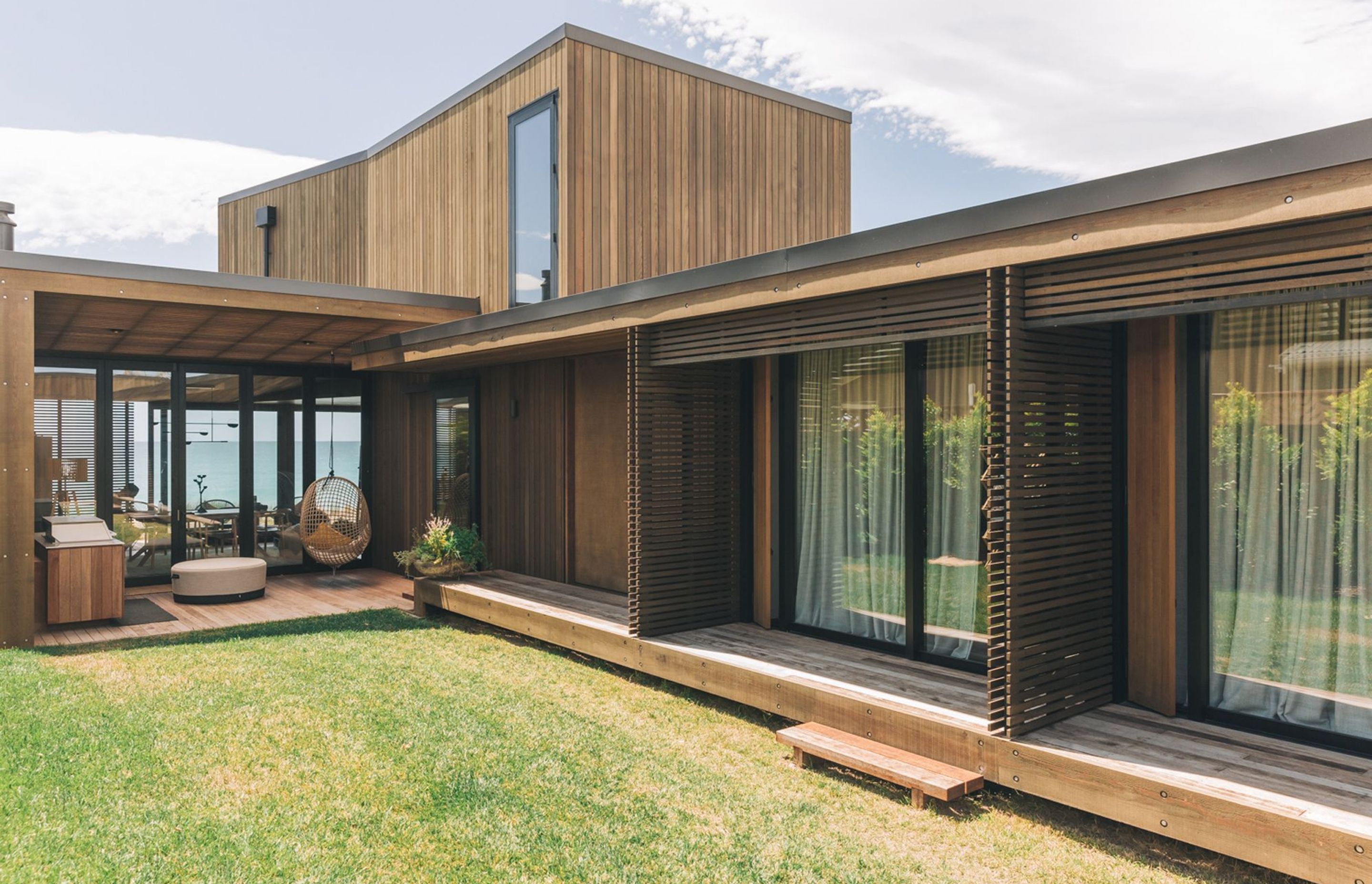 The central courtyard links each of the bedrooms on the ground floor with the entertaining area and beachfront beyond.