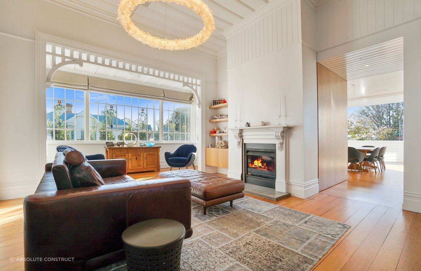 A living room that exudes warmth, thanks in no small part to the statement fireplace.