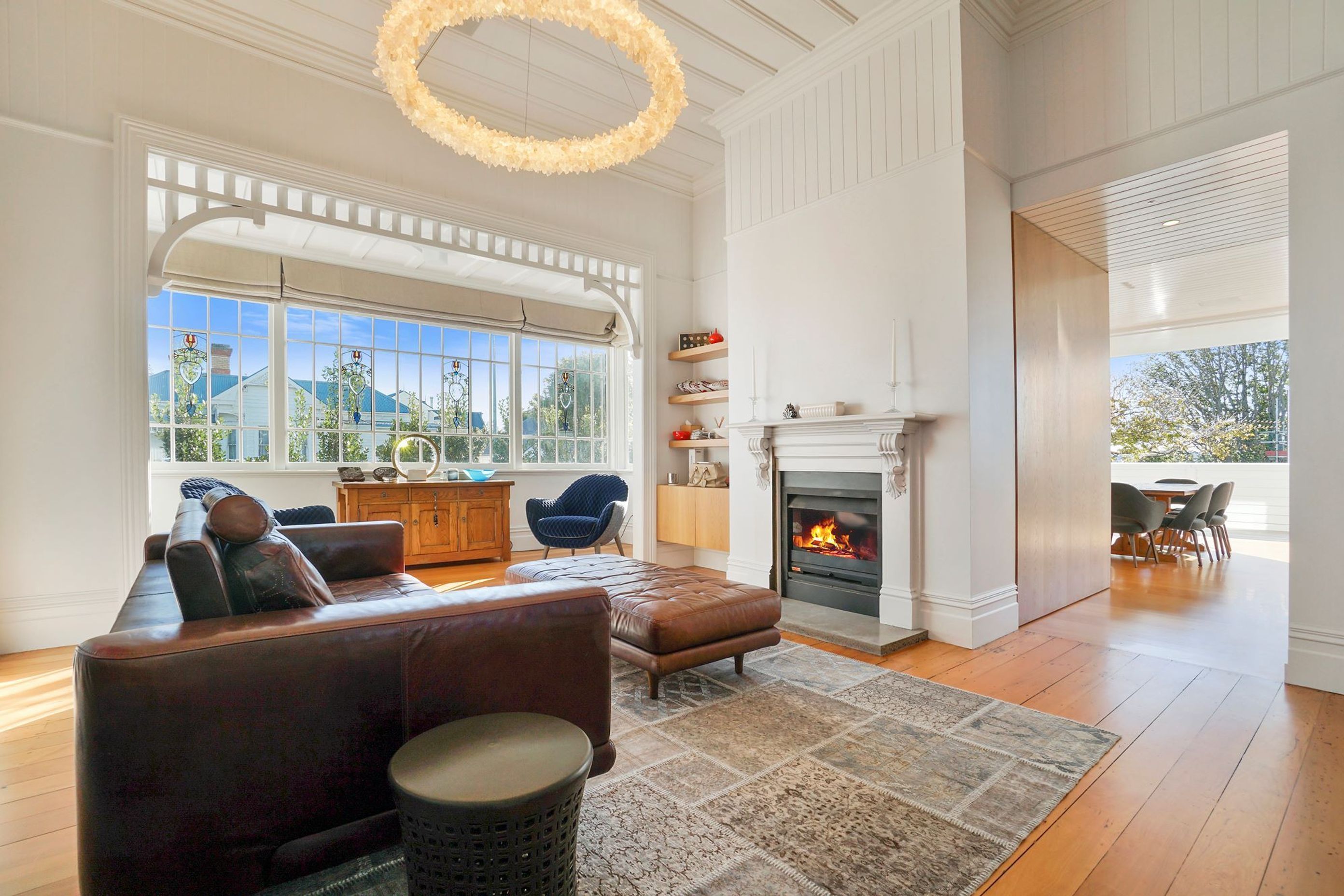 A living room that exudes warmth, thanks in no small part to the statement fireplace.