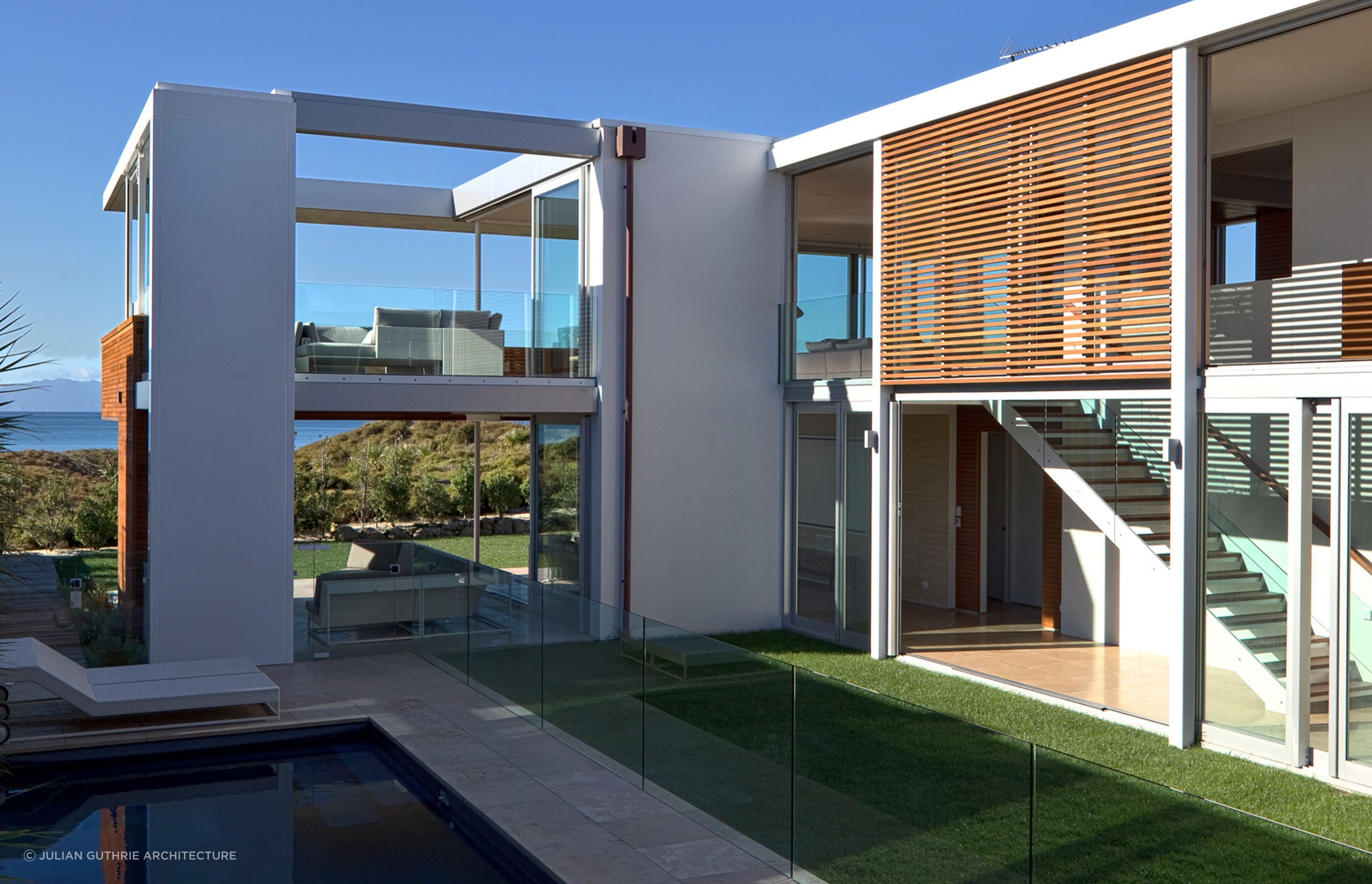 The clever layout of the home brings an immaculate lawn and swimming pool closer to the living spaces. | Photography: Patrick Reynolds