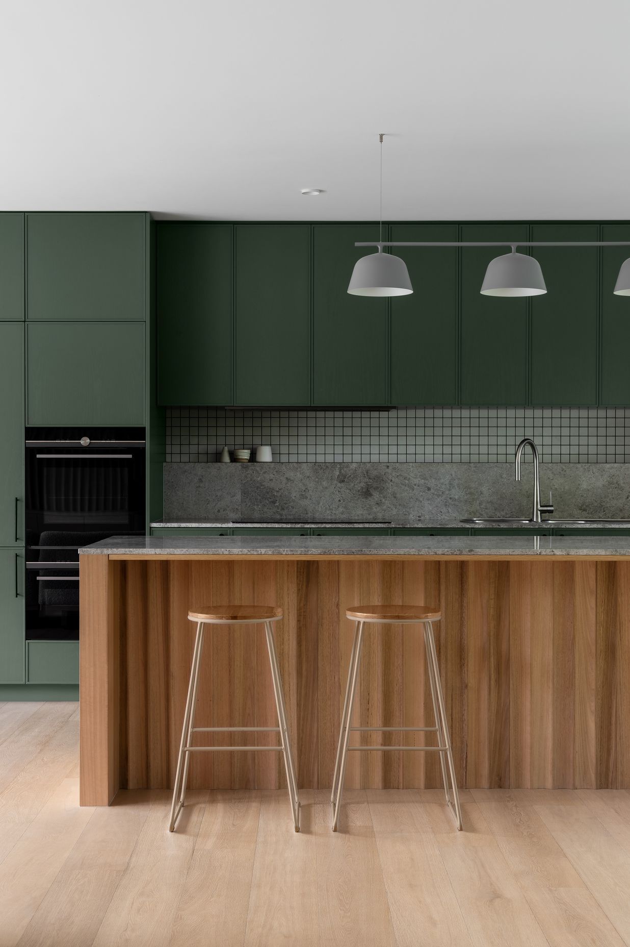 Wood paneling warms the kitchen.