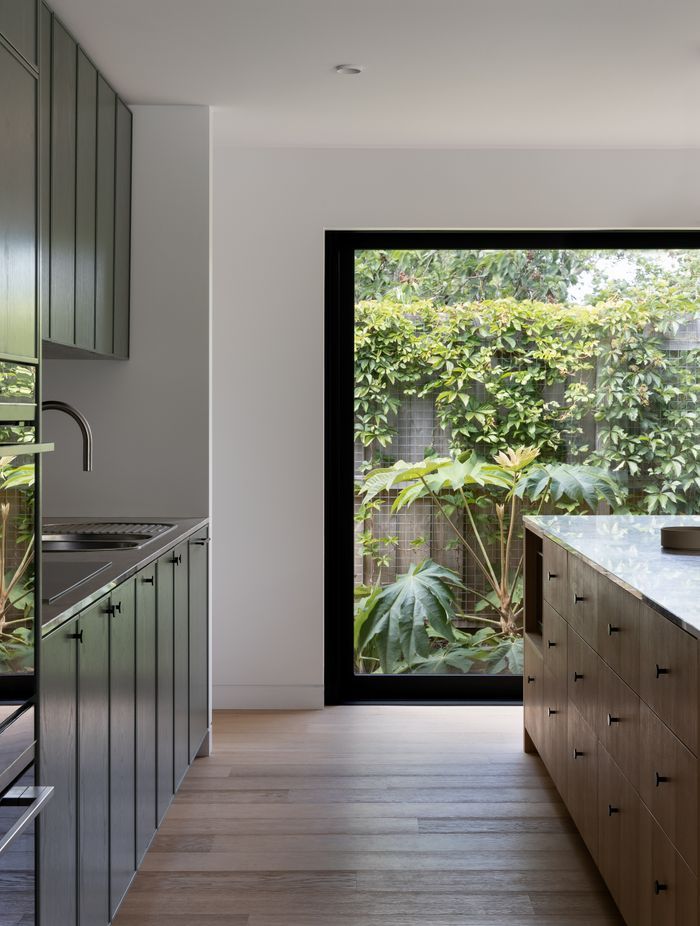 Black frames add drama to the outside greenery.