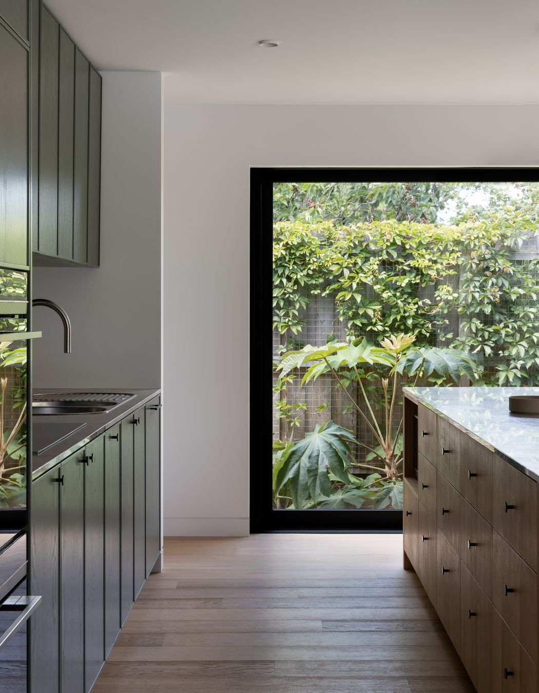 Black frames add drama to the outside greenery.