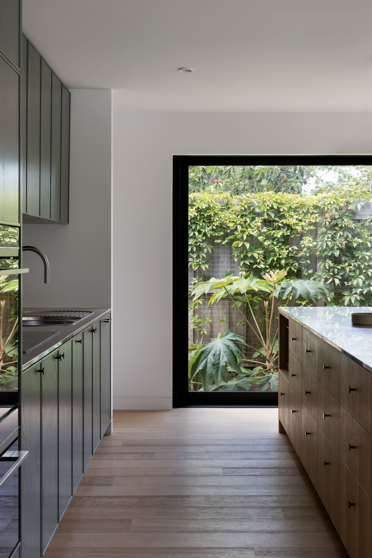 Black frames add drama to the outside greenery.