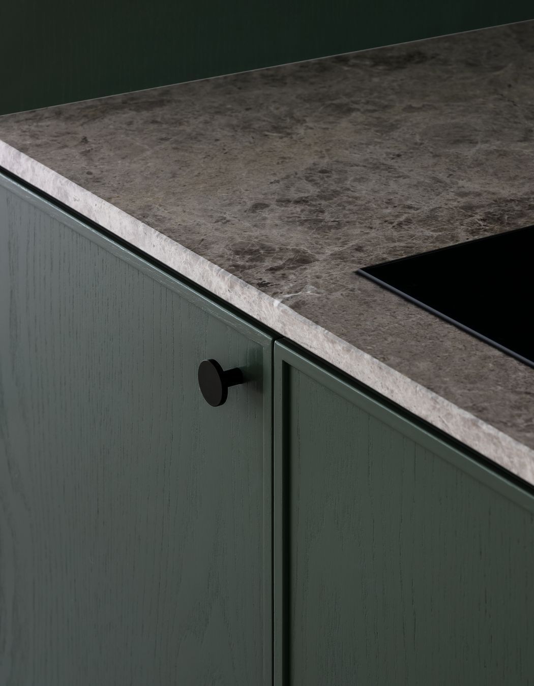 Wood grain cabinetry and marble bench tops add interest and texture.