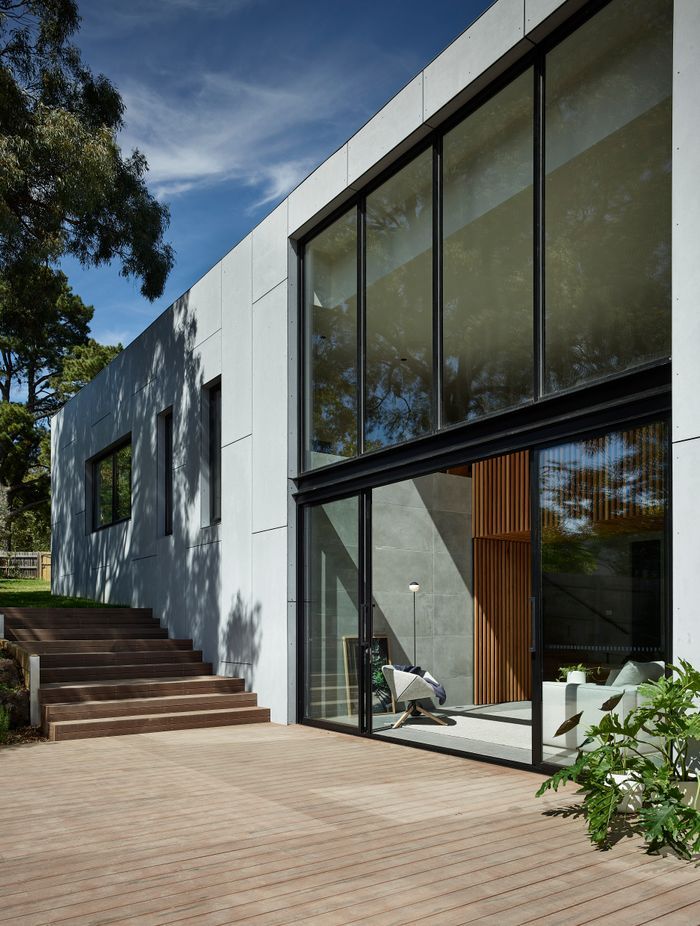 Floor-to-ceiling glazing connects the outside and in, with the deck an extension to the living area.