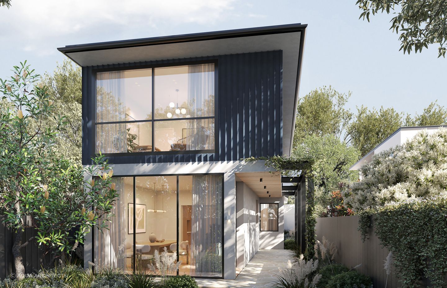 Surrounded by a garden oasis, the home embraces the greenery and natural light through floor-to-ceiling windows in the downstairs living space.