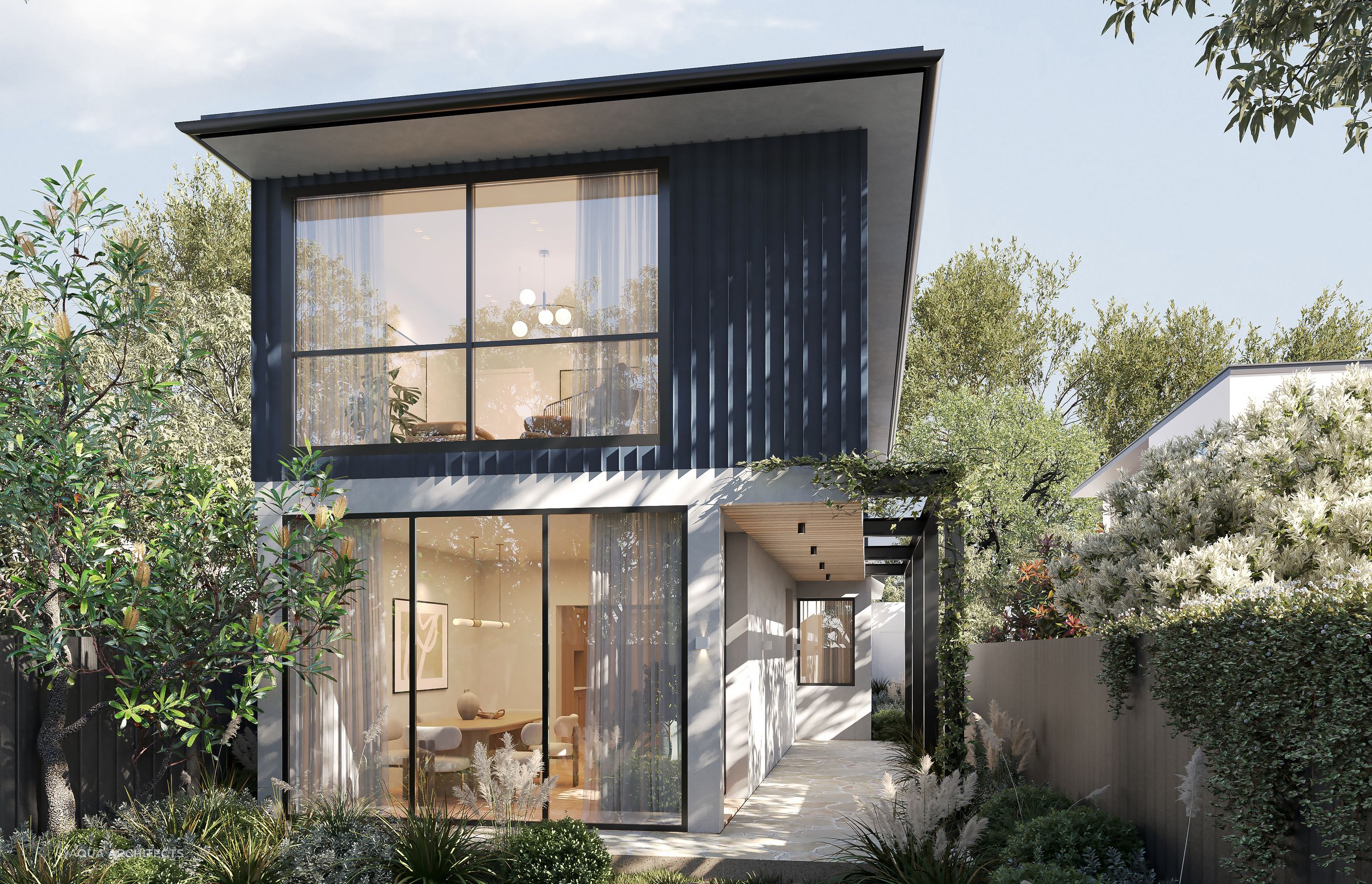 Surrounded by a garden oasis, the home embraces the greenery and natural light through floor-to-ceiling windows in the downstairs living space.