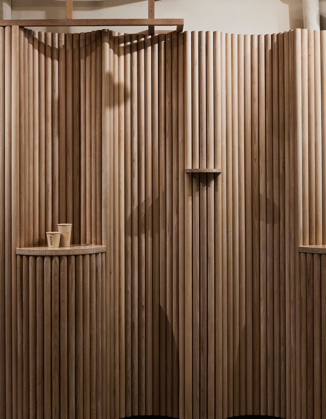 The sculptural form of the timber allows the existing services to be hidden.