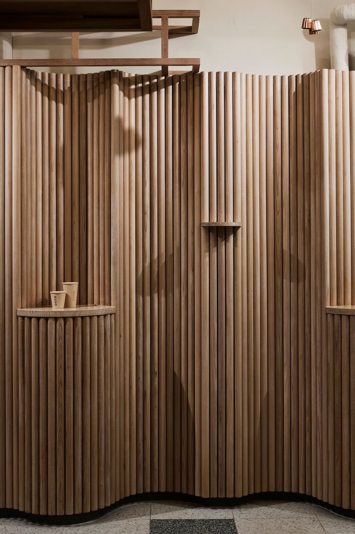 The sculptural form of the timber allows the existing services to be hidden.