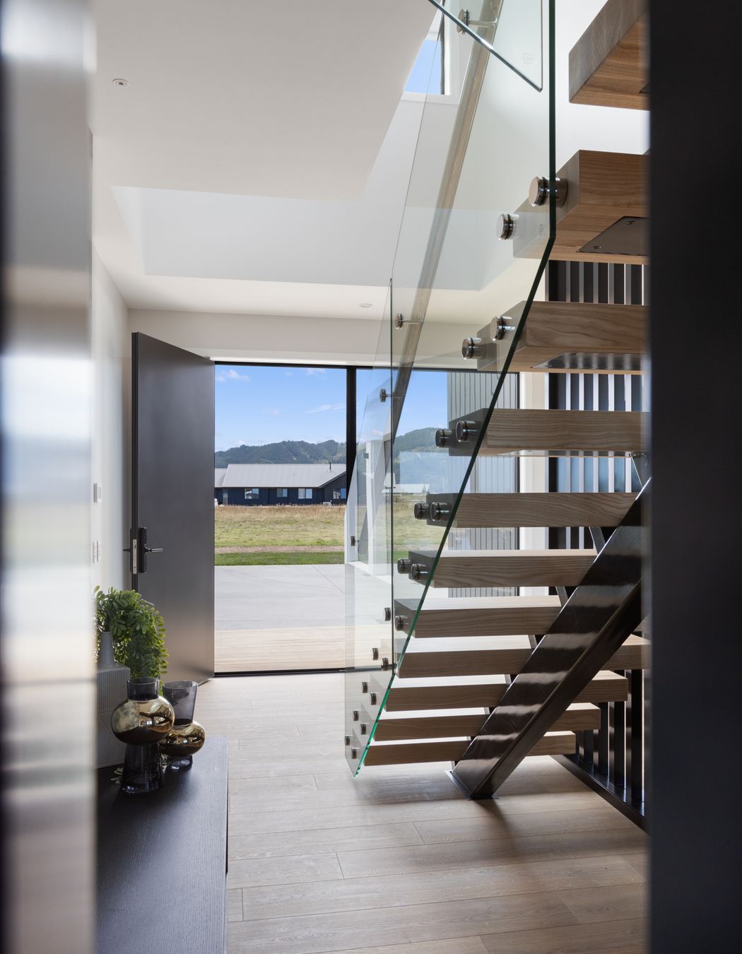 “We wanted the first impression of the home to be memorable, and the staircase, especially when lit up at night, achieves just that,” says Quigley.