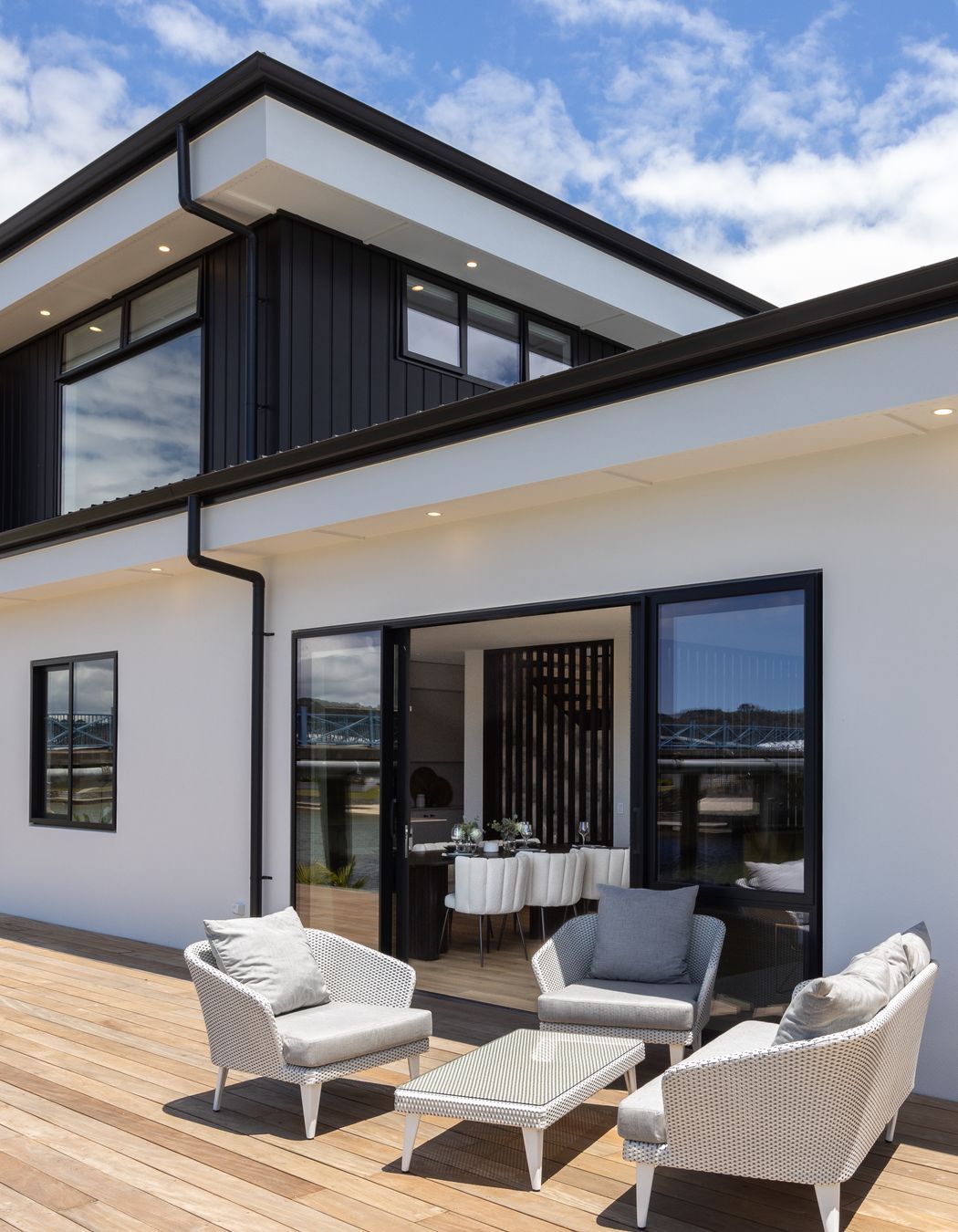 The deck wraps around two sides of the home, offering many spaces for relaxation and entertainment.