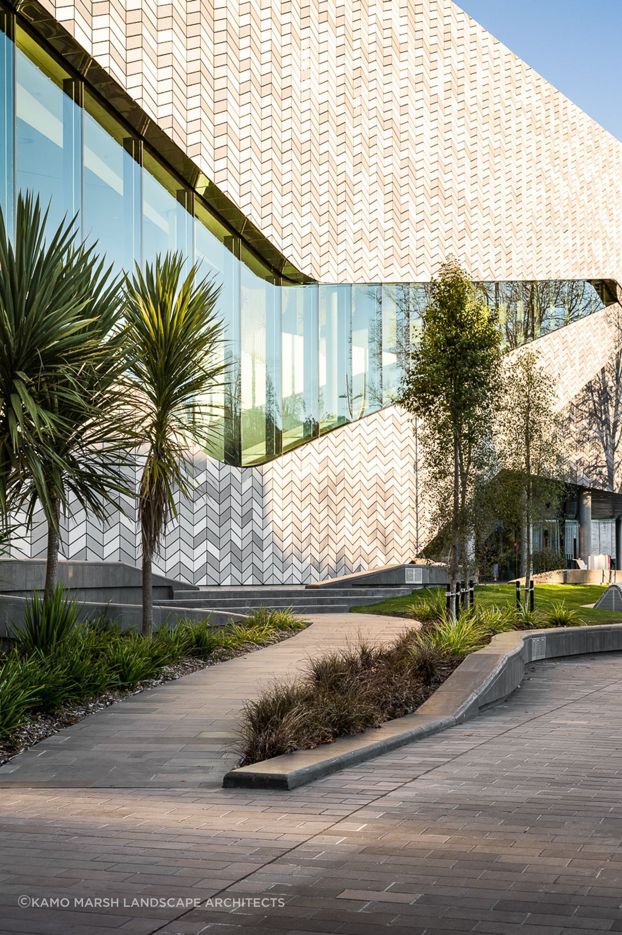 The plants are predominantly native species, selected to reflect a transition from the river to the mountains that the building represents.