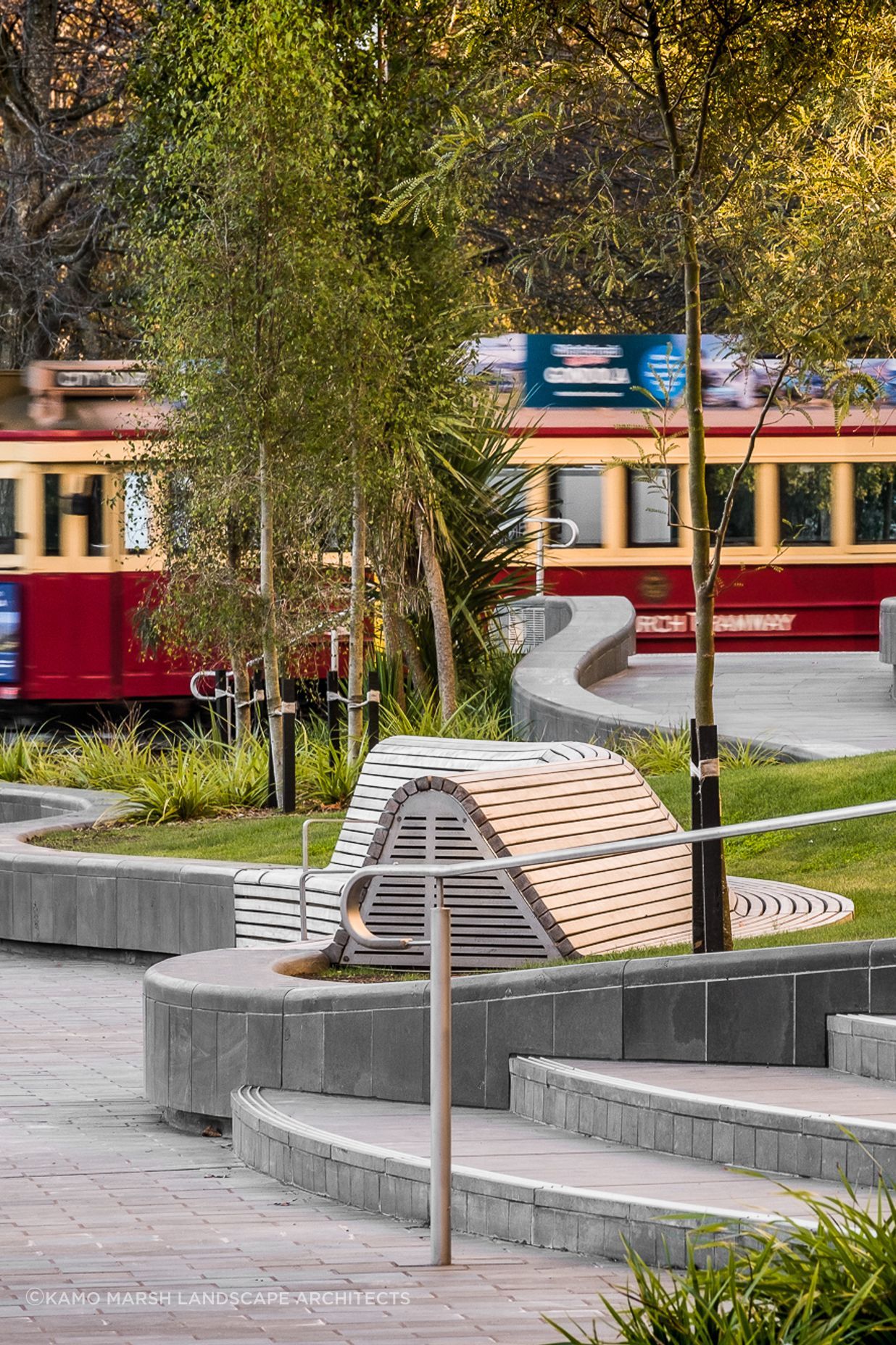 The landscape's curved walls and benches nod to the fluidity of the Avon River.