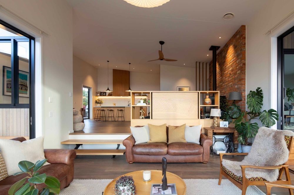 While the living area is open plan, levels and furniture have been used to create distinct spaces.