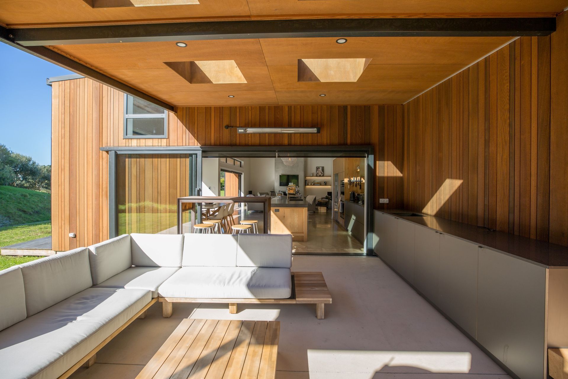 A sheltered and inviting outdoor living space that is enticing and stylish.