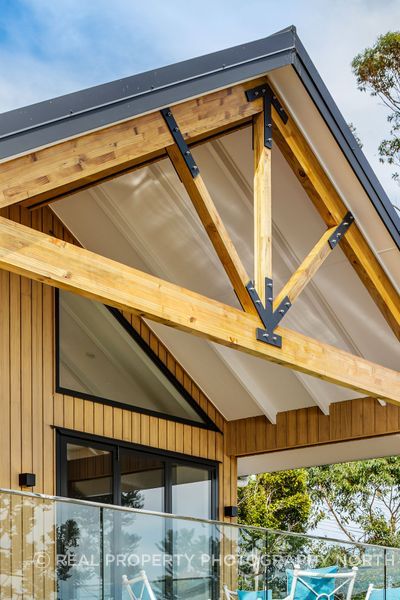 The trusses were custom made for the property, achieving a rustic, farmhouse feel.