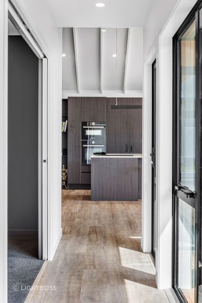 The interior palette effortlessly balances light and dark tones for a contemporary feel.