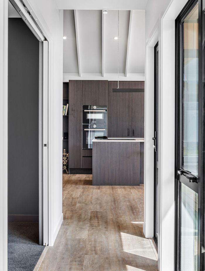 The interior palette effortlessly balances light and dark tones for a contemporary feel.