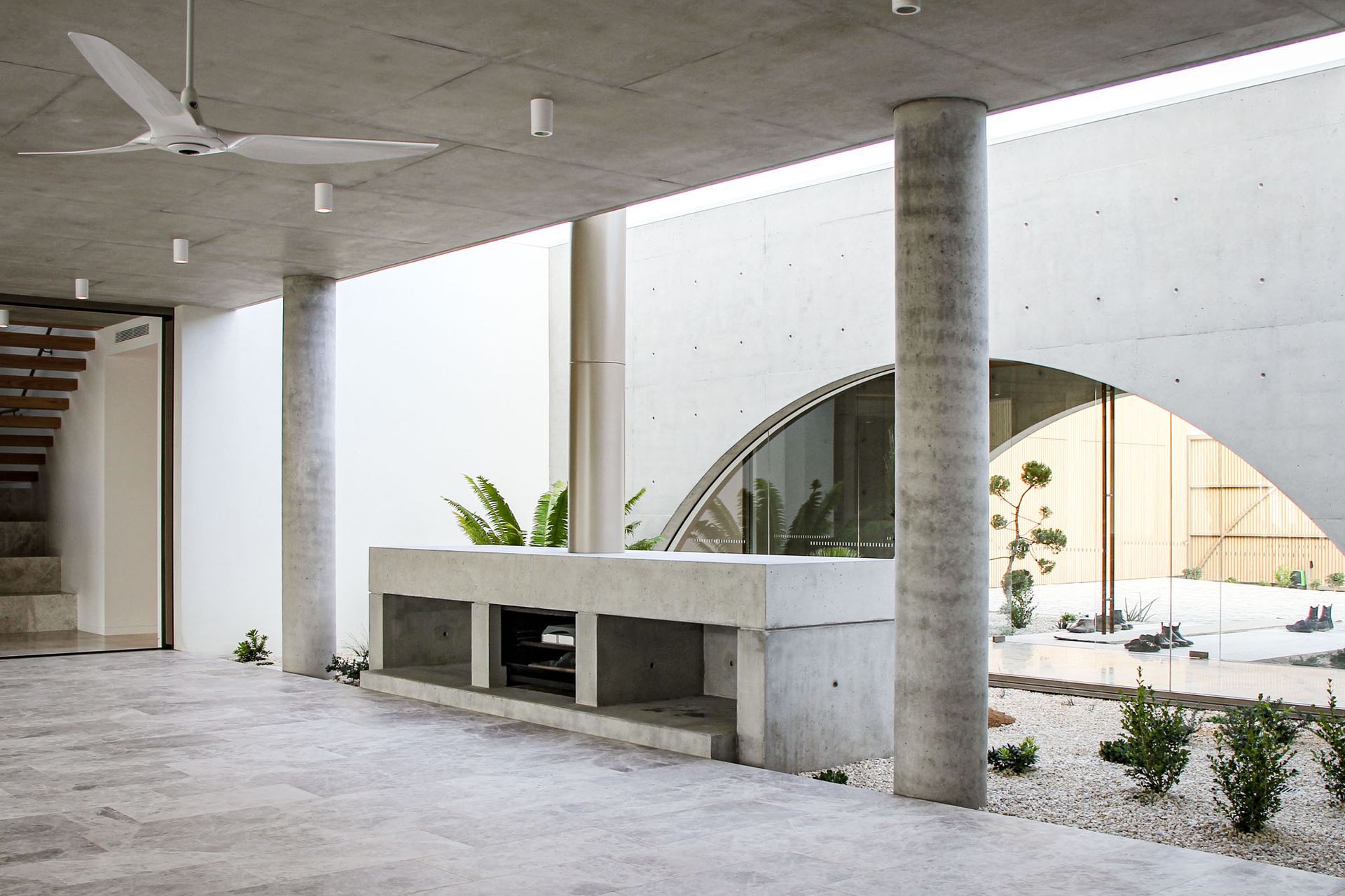 The stairwell and the entry space are glazed on either side, creating the feeling that indoor and outdoor spaces are one.