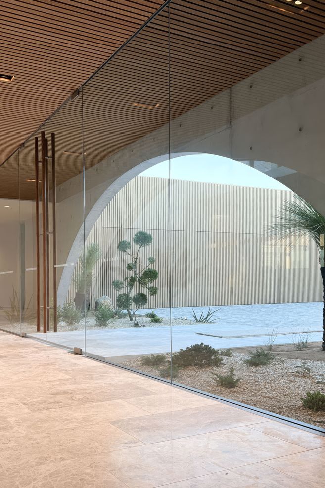 From inside the home. the floor to ceiling entry glazing suite enables light to pour into the home.