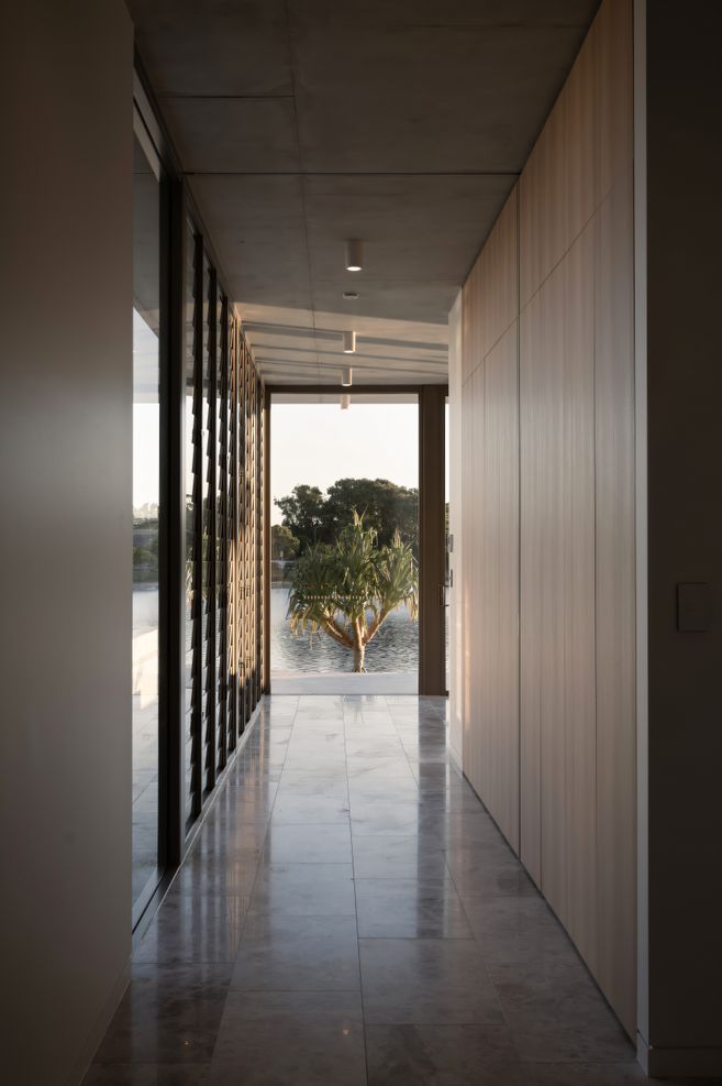 Looking straight through from the entry space, the glazing allows you to see right through to the waterway beyond.