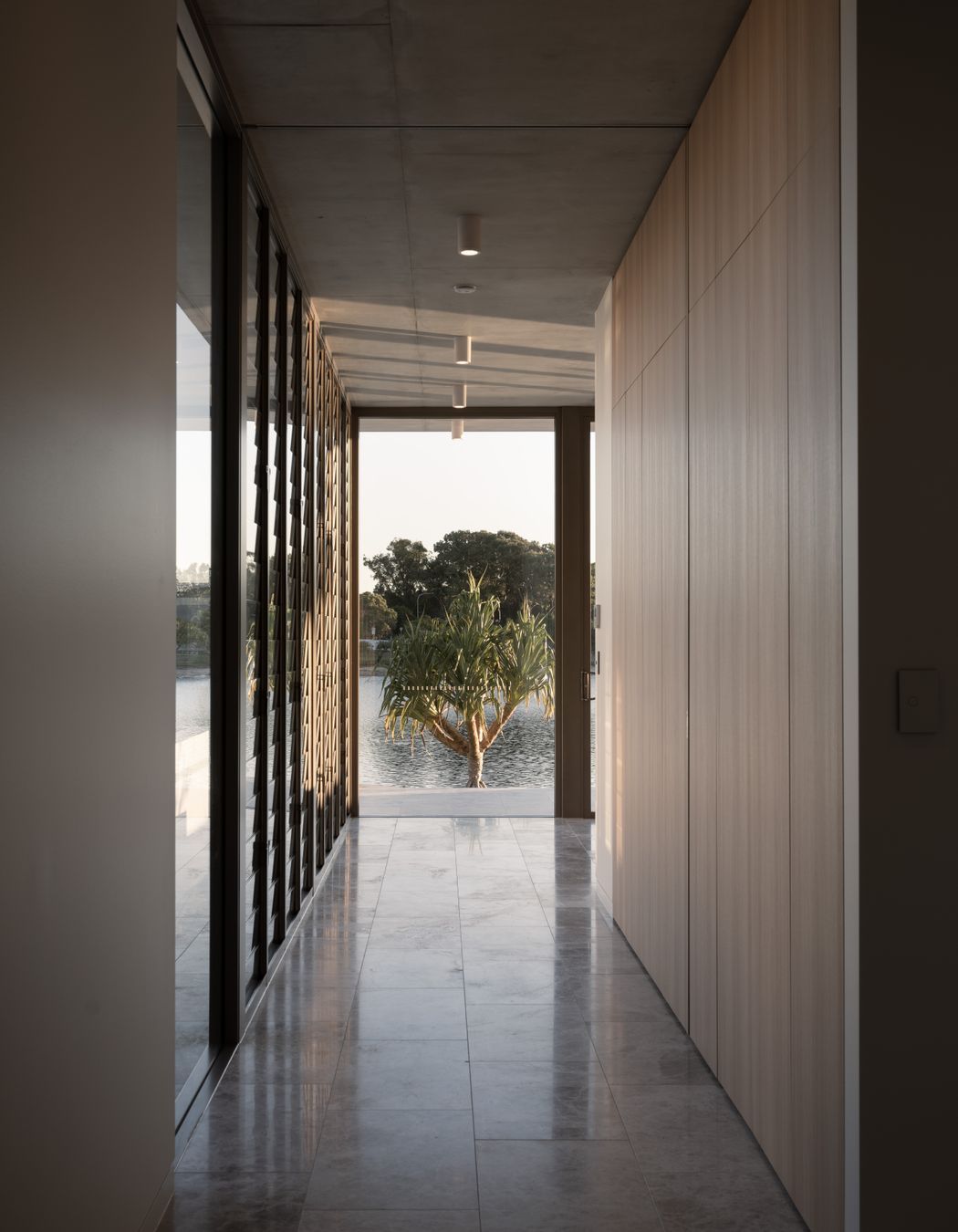 Looking straight through from the entry space, the glazing allows you to see right through to the waterway beyond.