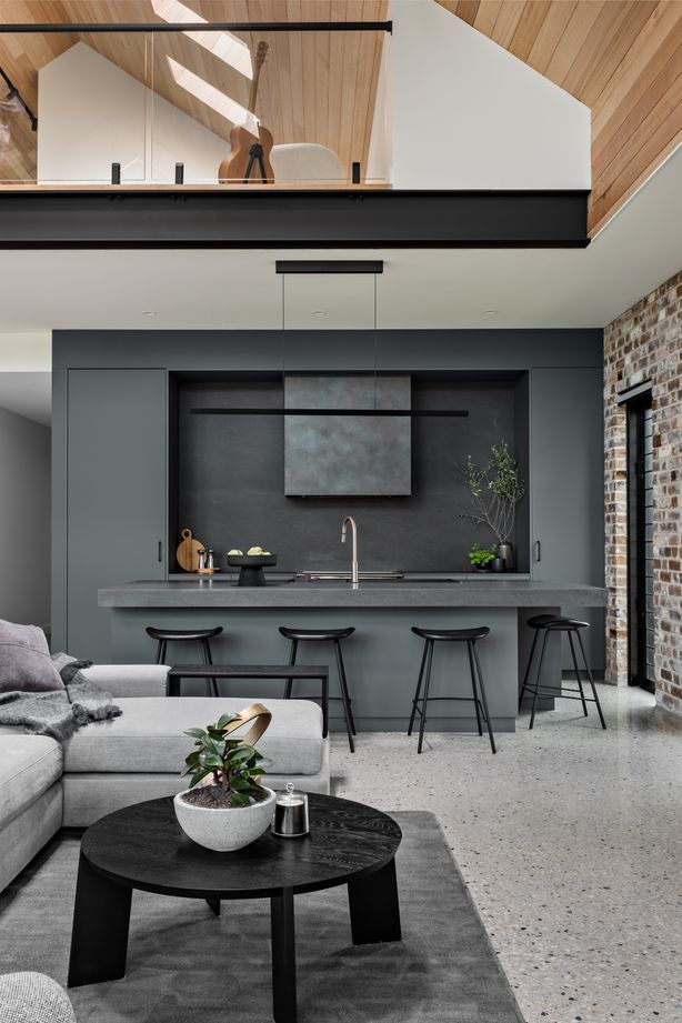 The teenager's retreat on the mezzanine floor is visually linked to the main living space.