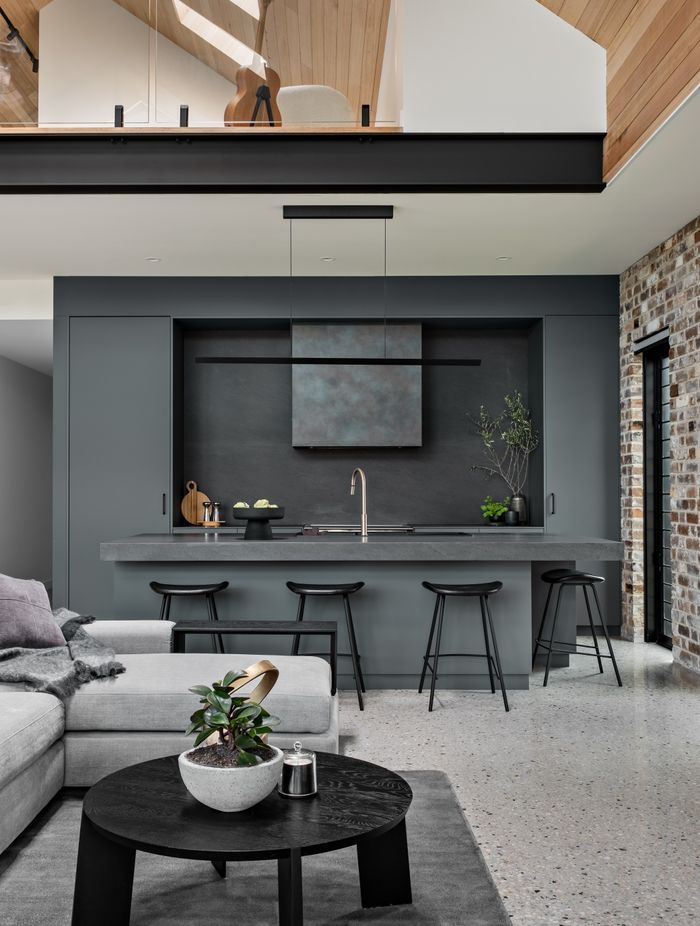 The teenager's retreat on the mezzanine floor is visually linked to the main living space.