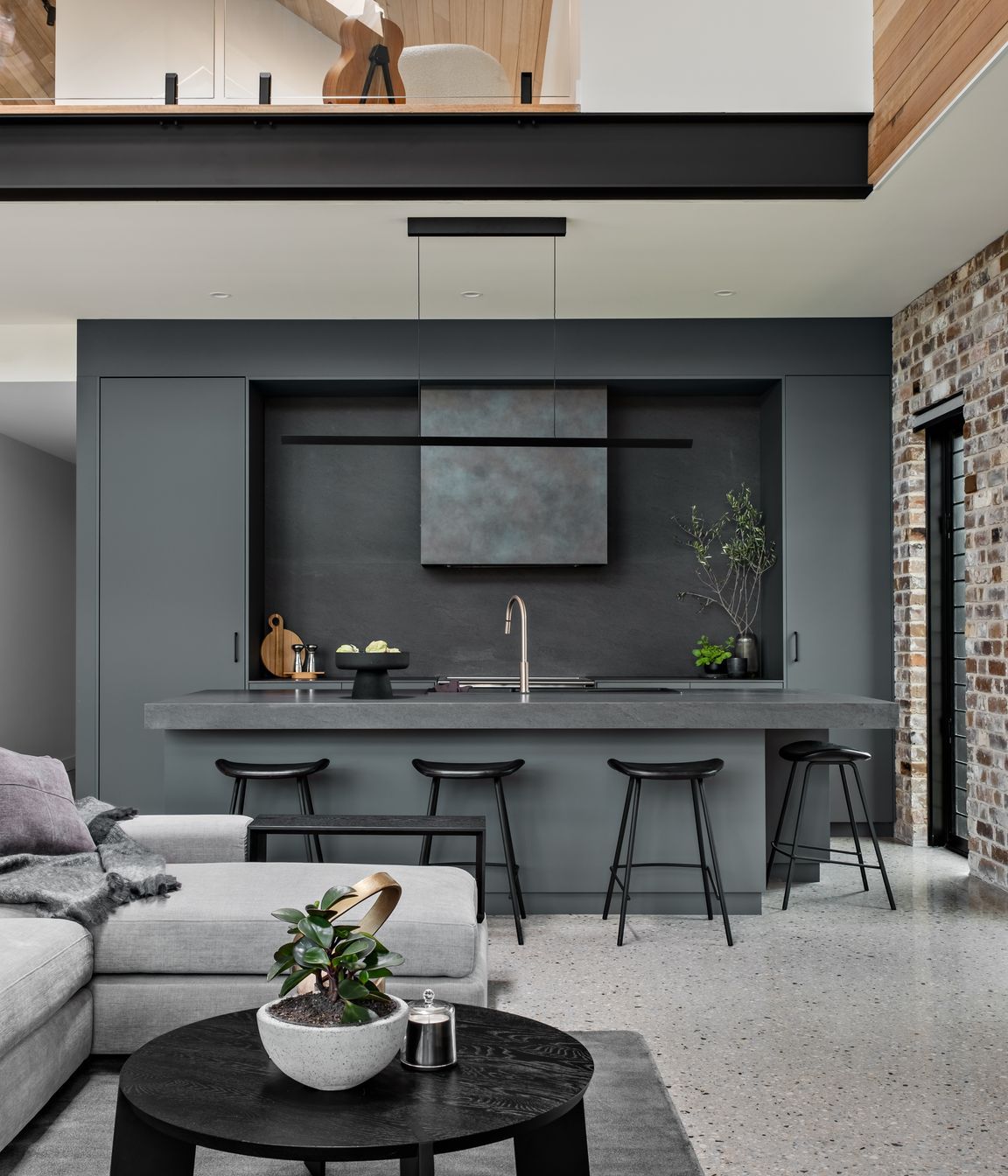 The teenager's retreat on the mezzanine floor is visually linked to the main living space.