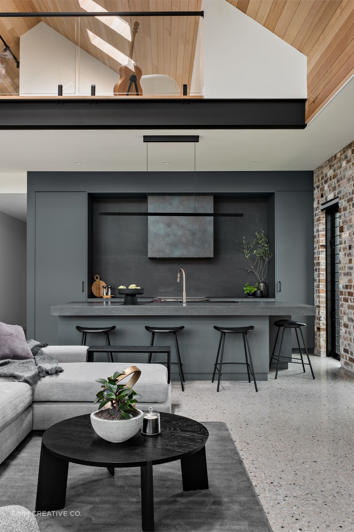 The teenager's retreat on the mezzanine floor is visually linked to the main living space.